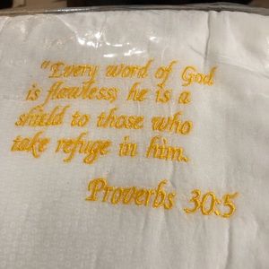 bible quote baby quilt.white with yellow writing,features 8 scriptures.